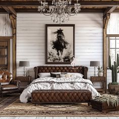 a large bed sitting under a chandelier in a bedroom