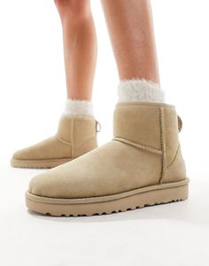 Slippers by UGG Cart-worthy find Ankle length Pull tab for easy entry Leather heel patch Overlock stitch detailing on seams Treadlite by UGG outsole provides bouncy cushioning and durable traction Box shows UK size to be half a size larger Please order your normal size