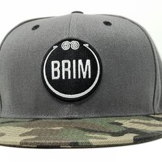 the brim hat is grey and camo with white embroidered logo on the front