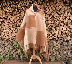 "The thick beige brown scarf is sewn from lamb's wool knit, wide and warm. Dimensions without fringes: 180 x 80 cm/ ~70 x 31 inches/, approximate weight: 870 g /1.92Lb/. Care tips for wool products. It is best to dry clean wool products (symbol \"P\") or wash by hand in lukewarm water(under 30 oC or 86 oF) with a liquid detergent. Machine wash in wool or delicate mode using a low speed spin or without using a centrifuge( also below 30 oC or 86 oF), allowing excess water to drain freely by curling the blanket over a thick cord or rod. Do not expose to heat or sunlight. Ironing. Adjust the iron to a two-point mark (Wool), iron from the left, preferably through a moistened white cotton cloth. You can also steam iron with just a light touch of the material." Brown Alpaca Shawl For Fall, Cozy Brown Shawl For Fall, Brown Wool Shawl For Fall, Brown Wool Shawl Scarf, Brown Alpaca Shawl, Beige Wool Shawl For Winter, Beige Wool Winter Shawl, Winter Beige Wool Shawl, Brown Winter Shawl Scarves