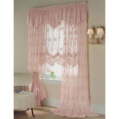 a pink curtain hanging in front of a window