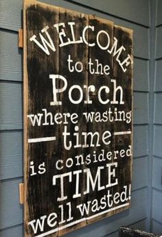 a wooden sign that reads welcome to the porch where washing time is considered time well wasted