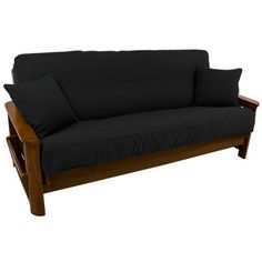 a black couch sitting on top of a wooden frame