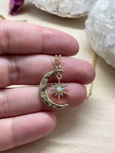 "This listing is for one gold crescent moon and star necklace. It has tiny cubic zirconia stones, and a man made opal inside it. This gorgeous statement piece hangs from a tarnish resistant gold chain. Your necklace will be stored in a hand stamped Kraft jewelry box, wrapped in bubble wrap, and mailed via USPS. If you spend over $35, domestic shipping is free! - \"All shadows of clouds the sun cannot hide like the moon cannot stop oceanic tide; but a hidden star can still be smiling at night's b Celestial Jewelry With Star Charm For Gifts, Celestial Style Star Charm Jewelry For Gifts, Celestial Crescent Jewelry With Star Charm, Mystical Jewelry With Star Charm For Gifts, Celestial Star Jewelry For Gifts, Mystical Star Charm Jewelry For Gift, Mystical Star Charm Jewelry Gift, Celestial Star-shaped Jewelry Gift, Celestial Gold Plated Jewelry Gift