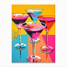 three martini glasses with different colored drinks in front of an orange, pink and blue background