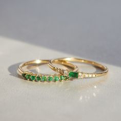 Rows of diamonds hug a baguette emerald, oh how we love baguettes (the cut and the bread) and how we love hugging. And how we love this ring! See Details for item specifics (carat weight, metal, etc). Baguette Cut Emerald Ring With Diamond Accents For Promise, Gift Emerald Ring With Baguette Diamonds, Fine Jewelry Emerald Ring With Baguette Diamonds For Anniversary, Baguette Ring With Single Cut Diamonds For Gift, May Birthstone Baguette Cut Diamond Rings, Emerald Baguette Cut Half Eternity Ring, Emerald Half Eternity Ring With Baguette Cut, Emerald Ring With Baguette Diamonds Gift, Green Emerald Ring With Baguette Diamonds For Wedding