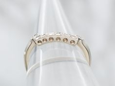 Get ready to walk down the aisle in style with this wedding band. Made from luxurious white gold and adorned with sparkling diamonds, this squared guard design adds a modern twist to the traditional wedding band. Make a statement on your special day!Metal: 14K White GoldGem: 8 Diamonds totaling .15 Carats, SI in Clarity, H-I in ColorWidth of Band: 2.1 mmHeight off Finger: 2.5 mmRing Size: 6.75 Antique Ring Guard, Black And White Diamond Ring Guard, Ring Enhancer Wedding Band Helzberg Diamonds, 10kt Diamond Ring Guard, Ring Guards Enhancer Gold And Silver Combined, Diamond Enhancer, Traditional Wedding Bands, Walk Down The Aisle, Pocket Watch Chain