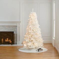 a white christmas tree in a living room