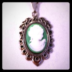 This Is A Gorgeous Handmade Superbly Detailed Cameo! From Her Hair, To The Roses On Her Dress, To Her Dainty Detailed Pearl Necklace! This Beautiful Green Cameo Is 1 1/8h X 3/4"W And Is Suspended From An 18" 925 Sterling Silver Chain With A Lobster Claw Clasp. Excellent Gift For Yourself Or Your Loved Ones! Comes Already Gift Wrapped And In A Fancy Gold Gift Box! Comes From A Smoke And Pet Free Environment. Please Ask Any Questions You Have. Offers Welcome! Bundle Items From My Closet And Save! Classic Cameo Necklace As Gift, Classic Cameo Necklace For Gift, Nickel-free Oval Pendant Necklace For Formal Occasions, Formal Nickel-free Necklace With Oval Pendant, Formal Nickel-free Oval Pendant Necklace, Round Silver Cameo Necklace, Victorian Cameo Silver Necklace, Silver Cameo Medallion Necklace, Silver Cameo Pendant Necklace