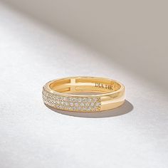 The Micro Pave Diamond Wedding Band is a stunning and elegant marriage ring crafted from 14k solid gold. This 3.80MM-wide ring features a minimalist design with a row of tiny diamonds that are meticulously set in a micro-pave setting. The total carat weight of the diamonds on the band is 0.3CT, adding a touch of sparkle and luxury to the ring. Features * Made to Order. * Gold KT: 10K, 14K, 18K * Custom Gold Color: Rose Gold, Yellow Gold, White Gold * Width of Band: 3.82MM * Thickness of Band: 1.32MM * Diamond Color-Clarity: D-E-F color VVS Clarity * Total CTW: 0.30ctw * Ready to Ship in 5-7 Business Days ✓ We care about the environment,the jewelry we cast is made with recycled gold. We source exclusively post-consumer material that is refined back to their pure elements to ensure that the Stunning Rings, Pave Diamond Wedding Bands, Micro Pave Ring, Marriage Ring, Ring Inspo, Classic Wedding Band, Matching Ring, Wide Ring, Thumb Ring