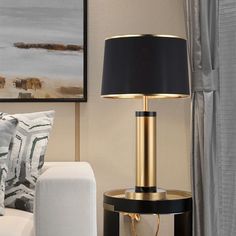 a black and gold table lamp in a living room