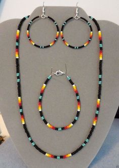 multicolored beaded necklace and earring set with matching hoop earrings on display