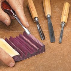 a person using a small tool to sharpen wood with other tools in the background