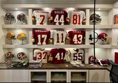 a football locker with helmets and jerseys on display