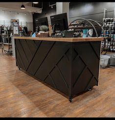 a large black counter sitting inside of a store