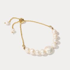 This exquisite Baroque Pearl Bracelet features an incredibly delicate chain that delicately drapes around the wrist while encasing a single stunning baroque pearl. Its sophisticated design, expert craftsmanship, and exclusive materials create an elegant look that exudes exquisite taste. DETAILS Plating: 18k Gold on Brass Materials:   18K Gold on Brass, Freshwater Pearl Measurements: Length: 3.54"(9.0cm) + Extender: 5.51"(14.0cm) Weight:  9.52g Note: It will be in stock in 7 business days! White Pearl Bracelets With Adjustable Chain, Formal White Bracelets With Adjustable Chain, Elegant Wedding Pearl Chain Bracelet, Elegant Adjustable Chain Bracelet With Pearl Charm, Adjustable Pearl White Bracelet With Pearl Chain, Elegant Adjustable Pearl Charm Chain Bracelet, Adjustable Pearl White Bracelets With Pearl Chain, Elegant White Pearl Bracelet With Extender, Elegant Wedding Chain Bracelet With Extender