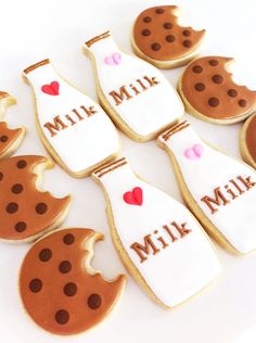 decorated cookies arranged in the shape of milk bottles