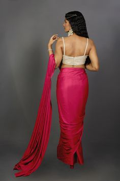 Engage your personality with the luxurious feel of this Satin One Minute Saree in Pink Red dual tone shades. Drape this specially for any festive, party, or wedding occasion.Product Features: Saree Color: Pink & Red Blouse Color: Gold Saree Fabric: Satin Blouse Fabric: Gold Art Silk (For beige metallic blouse choose the fabric option at check out) Work: Ombre Shoulder Drape: Customer must select the shoulder drape style while ordering Occasion: Party , Cocktail Party ,Wedding Reception, Bridesma Silk Draped Choli For Wedding, Pink Draped Sets With Zari Work, Bollywood-style Draped Wedding Blouse Piece, Draped Lehenga With Dupatta For Wedding, Wedding Lehenga With Draped Dupatta, Festive Draped Art Silk Dupatta, Bollywood Style Draped Art Silk Lehenga, Bollywood Draped Art Silk Lehenga, Wedding Lehenga With Zari Work And Draped Shape