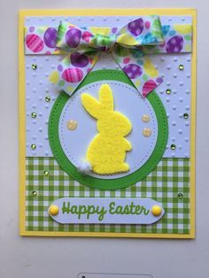 a handmade easter card with a yellow bunny on the front and green checkered background