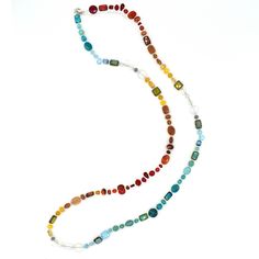 This necklace is made from a gorgeous mix of natural gemstones and Czech glass. Each necklaces is one-of-a-kind and contains carnelian, opalite, red aventurine, ruby jade, turquoise, teal jade and goldstone. Features a sterling silver lobster clasp and chain at the back. This versatile piece can be worn three ways: long, doubled, or as a bracelet. Adjusts from 40 inches to 44 inches long. Bohemian Recycled Glass Necklaces For Jewelry Making, Chalcedony Gemstone Necklace With Round Beads, Bohemian Glass Jewelry With Single Strand, Bohemian Single Strand Glass Jewelry, Bohemian Glass Single Strand Jewelry, Bohemian Round Glass Necklaces, Unique Single Strand Glass Necklaces, Chalcedony Necklaces With Natural Stones, Chalcedony Natural Stone Round Necklaces