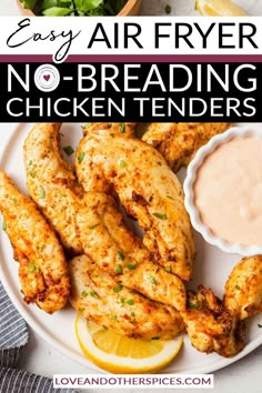 easy air fryer no - breading chicken tenders on a plate with lemon wedges