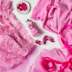 some pink items are laying out on the table