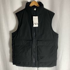 Zara Puffer Black Vest With Front Pockets Size M Black Techwear Puffer Jacket With Pockets, Black Utility Vest For Winter, Functional Black Outerwear With Pockets, Urban Fall Vest With Pockets, Urban Vest With Pockets For Fall, Urban Style Vest With Pockets For Fall, Urban Style Fall Vest With Pockets, Winter Workwear Puffer Vest, Fall Streetwear Vest With Multiple Pockets