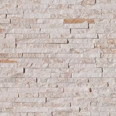 a white brick wall that is made out of marble blocks and has no mortars