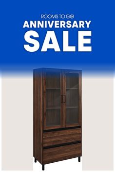 a wooden cabinet with glass doors and the words rooms to go anniversary sale