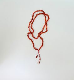 .Jewelry for you to have elegance and style .Real coral beads are knotted on string. .Braided pendant is decorated with pearls and hemetite. .Very stylish and powerful coral necklace that will harmonize with you. .Coral protects and makes you feel good.🌬 💌D E T A İ L S Handmade and unique  Bohemian style Materials:Gemstone Necklace Length: 37 CM (15 inches) Pendant high: 6 CM (3 inches) Knot Chain 📐L E N G T H  A D J U S T M E N T S Measurements and weight are close approximations. If have co Orange Red Coral Beaded Necklaces Hand-strung, Red 8mm Beads Jewelry For Meditation, Red Gemstone Beaded Necklaces For Meditation, Hand-strung Orange Beads As A Gift, Adjustable Orange Jewelry With 108 Beads, Red Hand-strung Jewelry For Meditation, Spiritual Orange Necklace Made Of Red Coral, Red Carnelian Beads For Gift, Red Carnelian Beads For Gifts