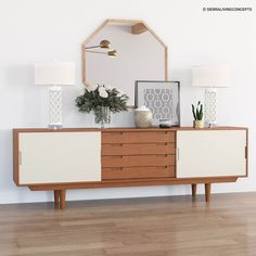 a white and brown dresser sitting on top of a hard wood floor next to a mirror