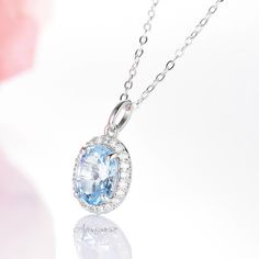 "Gorgeous aquamarine is surrounded by round brilliant simulated diamonds (CZ) set in sterling silver (925) Gemstone information: Center Stone: Aquamarine Gemstone creation: Simulated Measurements: 8.0 x 10.0 mm Carat Weight: 2.3 ct. (approx.) Hardness: 8 (Mohs scale) ►Chain length: 18\" (incl. 2\" extender). ►Matching ring can be purchased at: https://www.etsy.com/listing/670530253/aquamarine-ring-sterling-silver-ring?ref=listings_manager_grid ►Matching earrings can be purchased at: https://www. Cubic Zirconia Necklace With Center Stone For Gift, Diamond White Oval Jewelry With Birthstone, Light Blue Round Cubic Zirconia Jewelry, Light Blue Cubic Zirconia Jewelry, Sapphire Crystal Jewelry For Anniversary, Oval Diamond White Jewelry With Birthstone, Classic Blue Necklace With Accent Stones, Elegant Blue Jewelry With Halo Design, Light Blue Jewelry For Wedding