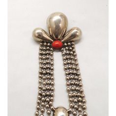 This is part of Chairish’s Costume Jewelry assortment.  1980s Deco style silvertone cabochon faux-carnelian long brooch with security clasp. Marked "Pellini." Measures: 5 5/8 inches long by 1 15/16 inches wide. Condition: Very good; some tarnishing to the silvertone, some wear to the back. Deco Style, Costume Jewelry, Silver Tone, Italy