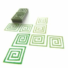 a rubber stamp that has squares and rectangles in it on a white surface