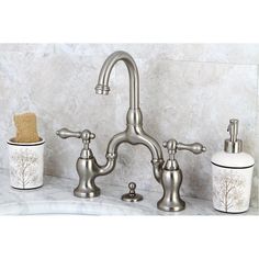 a faucet with soap dispenser, toothbrush holder and tissue dispenser