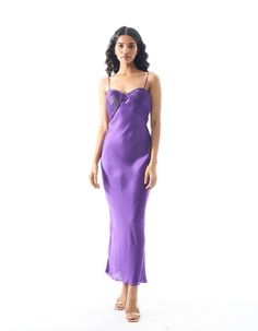 Modal satin slip dress with ruched top detailWear her out a few nights and you’ll soon realise that the Bella Donna Dress is a beauty you can count on. The satin slip dress features an alluring ruched neckline, and comes in an enlivening, vivid, violet hue. Tailored to a slim-fit silhouette with a side-zipper closure to keep you snug.Product details: Material/Fabric - Modal Satin Fit- Slim fit Closure - Side zipper Size chart: SIZE 6 8 10 12 14 16 18 20 (XXS) (XS) (S) (M) (L) (XL) (XXL) (XXXL) B Pre-draped Satin Dress With Spaghetti Straps, Sleeveless Satin Dress With Ruched Bodice For Date Night, Satin Midi Dress With Bias Cut And Fitted Bodice, Elegant Ruched Slip Dress With Spaghetti Straps, Feminine Silk Satin Dress For Date Night, Satin Midi Dress With Ruched Sweetheart Neckline, Fitted Bodice Satin Dress With Spaghetti Straps, Ruched Back Silk Dress, Modal Satin Dress With Spaghetti Straps For Date Night