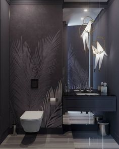 a modern bathroom with palm leaves on the wall