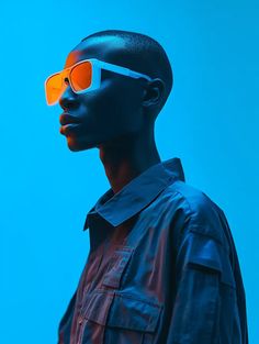 a man with orange sunglasses on his face