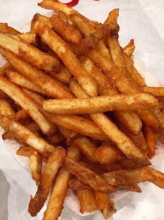 french fries are piled on top of each other