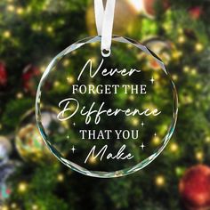 a glass ornament with the words never forget the differences that you make on it