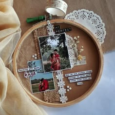 an embroidery hoop with pictures and words attached to it, sitting on top of a table