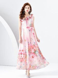 Beguiling in its ethereal beauty, this sleeveless maxi dress is a masterpiece of artful prints and soft, flowing fabric. The whimsical pattern evokes a dreamlike cityscape, enriched with vibrant splashes of color that mimic the transient beauty of a sunset skyline. The high neckline is graced with delicate ruffles, lending a romantic air to the overall design. A sash cinches the waist, offering a flattering silhouette, while the lightweight material dances around the ankles, perfect for an eveni Pink Printed A-line Maxi Dress, Multicolor Chiffon Maxi Dress, Feminine Sleeveless Maxi Dress For Spring, Multicolor Chiffon Maxi Dress For Garden Party, Pink Printed Floor-length Maxi Dress, Pink A-line Maxi Dress With Floral Print, Multicolor Ruffled Floor-length Maxi Dress, Multicolor Chiffon Maxi Dress With Floral Print, Feminine Sleeveless Chiffon Maxi Dress