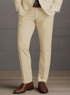 The ultimate comfortable outfit choice a man could ever have are our stretch pants which also keeps your sense of style in the forefront at your next evening do. Crafted from cotton lycra blend, the Beige Feather Cotton Canvas Stretch pants preserve its allure unaltered so as one can exude stylish statement. Combine it with a matching jacket and waistcoat, a white shirt, patterned black tie and black dress shoes.  Look Includes  Beige Feather Cotton Canvas Stretch Fabric  Cross Pocket  Flat Front  Two Welted Back Pockets on Trousers   Click 'Customize Now' to modify the look if needed.   Lining: Viscose; Dry Clean. Stretch Ankle-length Dress Pants For Semi-formal Occasions, Slim Fit Full Length Elastane Pants, Fitted Pants For Business Casual, Fitted Chinos With Welt Pockets, Fitted Full-length Chinos With Pockets, Fitted Cotton Dress Pants With Pockets, Fitted Beige Pants With Welt Pockets, Semi-formal Stretch Straight Leg Pants, Fitted Cotton Bottoms For Business Casual