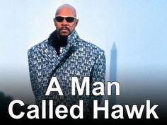 a man called hawk standing in front of a tall building with the words, a man called hawk on it