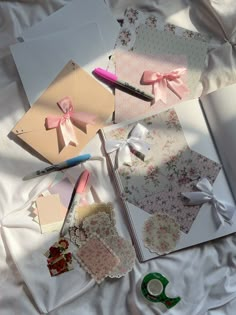 several different types of greeting cards laid out on a bed