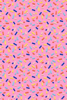 colorful sprinkles on a pink background