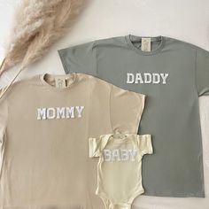 This matching family shirts is perfect for baby shower gifts, baby hospital coming outfit, pregnancy announcement, and family pictures or family photoshoot outfits! This is also perfect for gifting to your friends and loved ones for any occasions Note that the letters used are patches and are heat pressed. Our shirts run in a UNISEX fit. The shirts naturally have a slightly oversized fit giving extra room for moving around and comfort! For this reason, we highly recommend getting your true norma Family Matching Custom Print T-shirt For Gender Reveal, Custom Print Tops For Gender Reveal, Matching Custom Print Tops For Gender Reveal, Cute Family Shirt With Letter Print, Family Matching Soft-washed Cotton Tops, Cute Family Shirt With Name Print, Family Matching Cotton Shirt With Name Print, Matching Cotton T-shirt For Gender Reveal, Crew Neck Tops For Gender Reveal