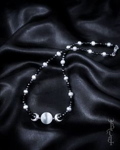 In honour of Artemis, Goddess of the wilds and Goddess of the moon. She who wears the crescent moon crown. An enchanting beaded strand featuring a Selenite sphere framed by crescent moons, and strung between black Onyx and silver freshwater pearls. This necklace depicts the Triple Goddess symbol,  the Selenite bead in the centre symbolising the full moon with a waxing and waning crescent on either side.  The crescent moon beads are produced in sterling silver and are uniquely textured by hand gi Triple Goddess Symbol, Moon Crown, Goddess Symbol, Waning Crescent, The Triple Goddess, Artemis Goddess, Goddess Moon, Moon Beads, Healing Crystals For You