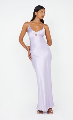 A bestselling design, the BEC + BRIDGE Cedar City Maxi Dress is a slinky V-neck style with a keyhole cut-out detail and contrast binding that carries through straps to tie-back. The bias-cut maxi is finished with a rolled hem, and an adjustable knotted strap which can be loosened and tied at desired length. This garment is certified Australian made. Lilac Hoco Dress, Lilac Satin Dress, Prom Dresses Tight, Light Purple Dress, Lilac Bridesmaid Dresses, Purple Dresses, Cedar City, Purple Prom Dress, Bec Bridge