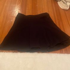 Black Flowy Skirt. Super Cute. Never Warn. Only Tried On. Has A Black Zipper In The Back Of The Skirt. Black Pleated Skort For Day Out, Casual Short Skirt For Going Out, Black Stretch Mini Skirt For Day Out, Black Pleated Mini Skirt For Day Out, Black Stretch Mini Skirt For Going Out, Black Flowy Skort For Party, Black Stretch Skirt For Day Out, Black Relaxed Mini Skirt, Flowy Pleated Black Skort